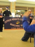 Citrus Heights Marching band, boy watches. Photo by Luke Otterstad