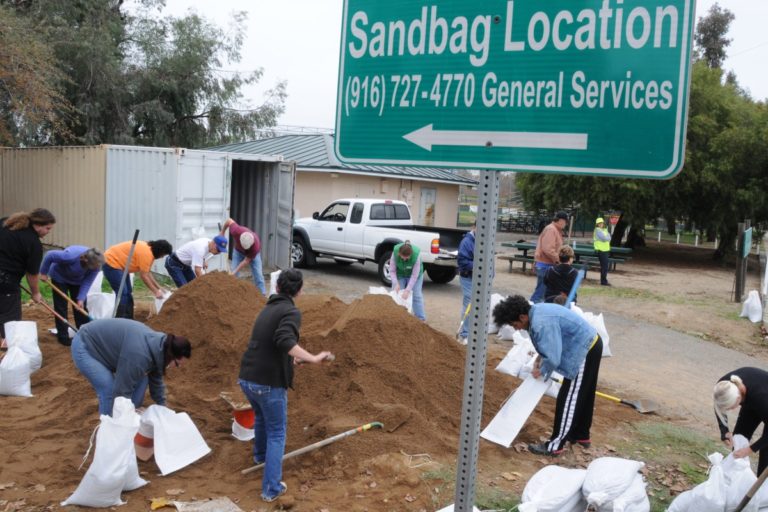 Citrus Heights residents fill up sandbags in preparation for storm. Photo by Luke Otterstad