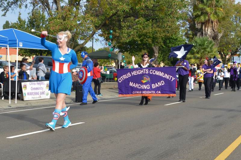 Led by Miss Captain America, The Citrus Heights Community Marching Band parades past the judges' booth during Saturday's Howl 'O Ween parade. // CHSentinel