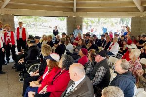 Mayor Tim Schaefer, front right, sits with other city leaders and residents during a Memorial Day ceremony at Sylvan Cemetery on May 29, 2023. // M. Hazlip