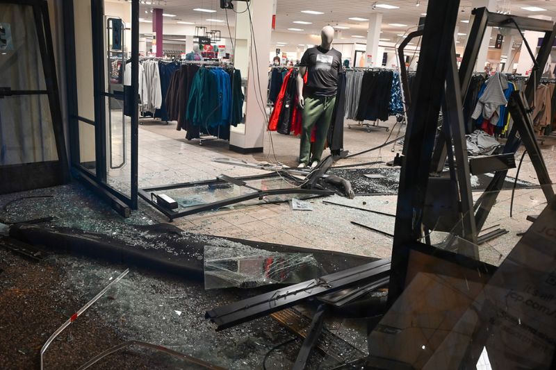 An unidentified suspect crashed their vehicle into JC Penny at the Sunrise Mall on Sunday, Dec. 16, resulting in damage. // Mike Hazlip