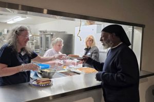 Volunteers serve food to the unhoused during the Winter Sanctuary program, Jan. 30, 2025 // Ade Zulfikar, Alfred Sanchez