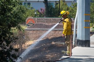 Sac Metro Fire District crews extinguished a small grass fire in Citrus Heights near Mitchell Village, Monday, July 7, 2025. // Mike Hazlip