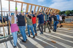 Volunteers and future homeowners took part in a wall raising for newly constructed homes for the Sayonara Housing Project on Friday, Aug. 15, 2025. // Charles McDonald Photography/Habitat for Humanity, Greater Sacramento
