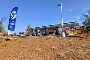 A "NOW OPEN" banner hangs in front of a new gas station and Sonic Drive In on Antelope Rd. and Roseville Rd.