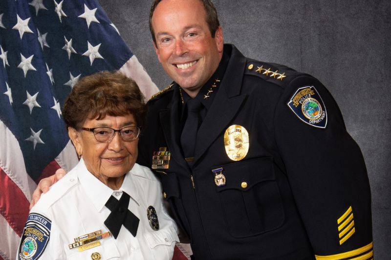 Long time police department volunteer Charlotte Corothers standing with Citrus Heights Police Chief Alex Turcotte. // Citrus Heights Police Department