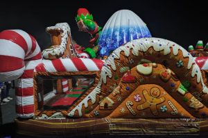 Kids enjoyed an inflatable gingerbread house during the 2024 Laser Light car show and night market at Sunrise Mall in Citrus Heights. // SB Williams