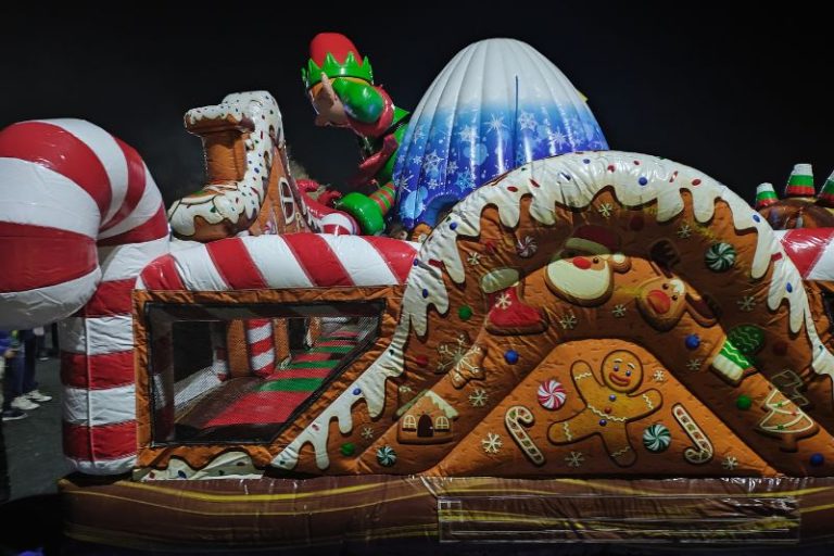 Kids enjoyed an inflatable gingerbread house during the 2024 Laser Light car show and night market at Sunrise Mall in Citrus Heights. // SB Williams
