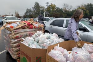 Associate professor Katherine Whitcom along with multiple students and another professor colleague help distribute Thanksgiving meals at Sunrise Christian Food Ministry Thursday, Nov. 20, 2025. // SB Williams