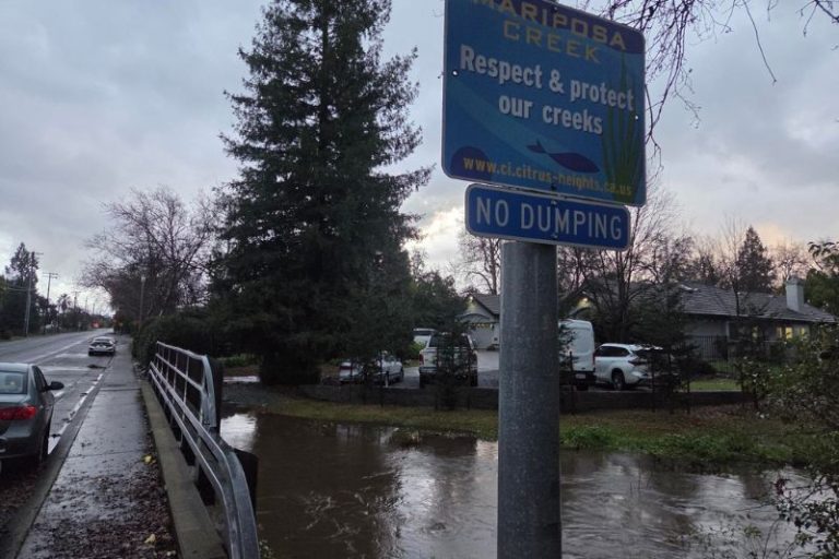 Photos from Mariposa Creek Bridge show the water reaching the bottom of the bridge and expanding tis banks. // Luke Otterstad