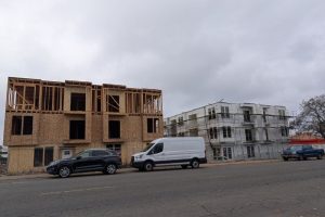 Two buildings cam be seen framed at the site of the future Sunrise Vista Apartments.