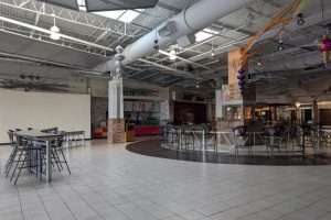 A fire burns inside the vacant food court at Sunrise Mall, January 2026