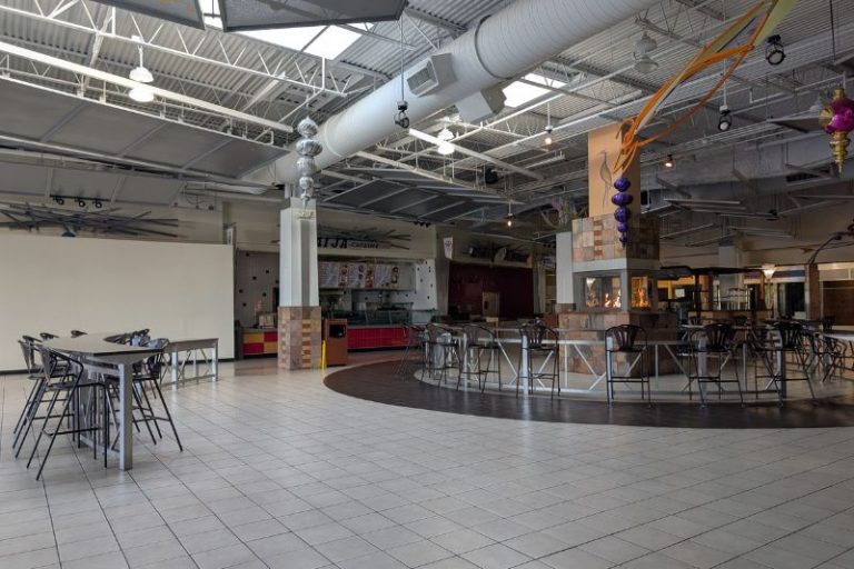 A fire burns inside the vacant food court at Sunrise Mall, January 2026