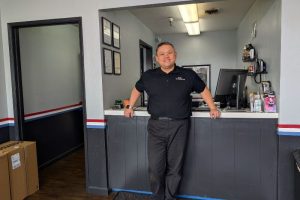 New owner Tom Ngo stands inside TN3 Automotive // SB Williams