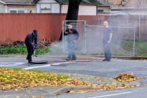 Sac Metro Fire crews could be seen uncovering a man hole to allow smoke to escape while investigating a fire that started in a storm drain on Rusch Drive. Jan. 1, 2026 // J. Williams