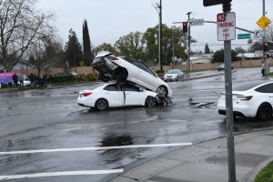 Photos shared with The Sentinel show one white sedan with severe front-end damage, with another white convertible positioned on top of the sedan at an angle in the middle of the intersection at Antelope Road and Daly Avenue. // submitted by James Collins
