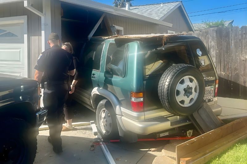 Photo of a vehicle into the wall of a house // Courtesy of Sacramento Metro Fire District