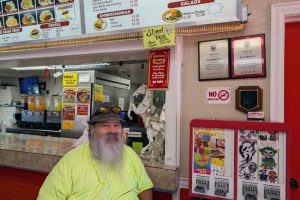 Alfred Sanchez visits inside Alberto's Mexican restaurant on Greenback Lane, after visiting and handing out supplies to unhoused in the area. // SB Williams