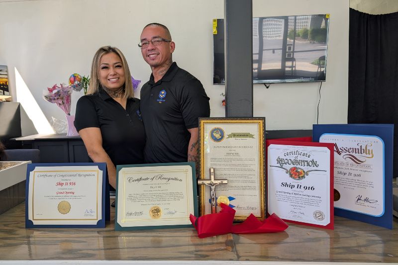 Abby and Merg Hernandez stand in their new shipping store, located at 7777 Sunrise Blvd. // SB Williams