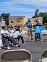 Citrus Heights City Manager Ash Feeney presented each of eight new homeowners with a housewarming gift during a home dedication ceremony Saturday. Housewarming gifts are a Habitat for Humanity tradition, officials said. June 6, 2026. // SB Williams