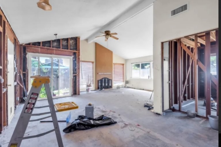 The three-bedroom, one-bathroom home at 8248 Lichen Drive appears, based on listing photos, to be somewhere in the middle of a major renovation, with much of the interior stripped down to the studs.