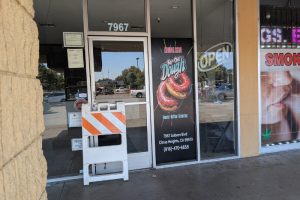 A donut shop on Auburn Blvd. has had "coming soon" signage on its windows for almost a year. // SB Williams